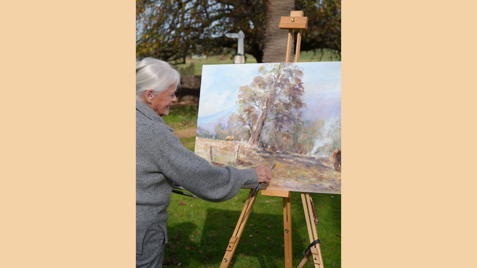 AA woman painting at an easel
